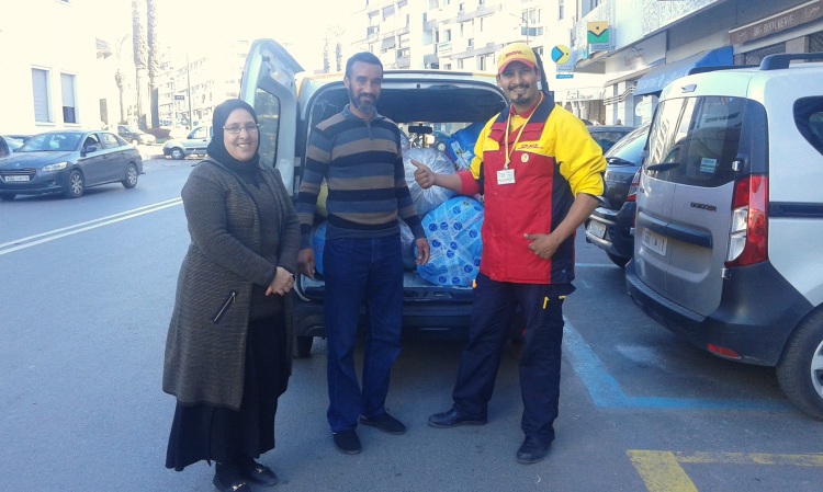Abdullah, DHL's amazing courier, picks up shipments from Anou's office. 